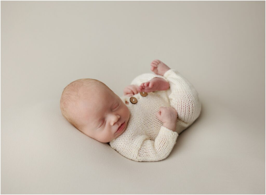 Baby boy in knitted romper