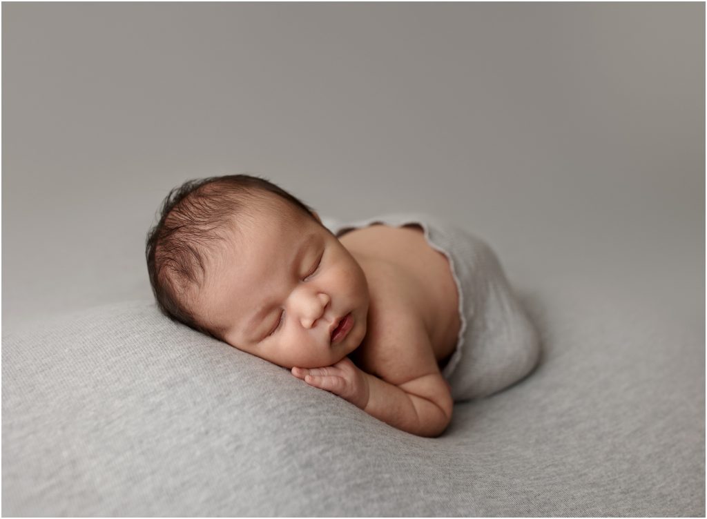 Baby on gray backdrop | Utah Newborn Photographer