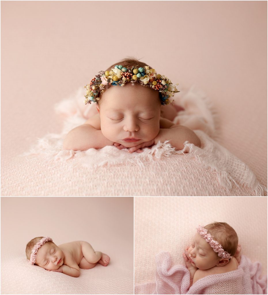 Newborn girl on pink backdrop